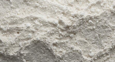 Fototapeta premium Granular surface detail of white powdered gypsum and diatomite highlighting industrial raw materials