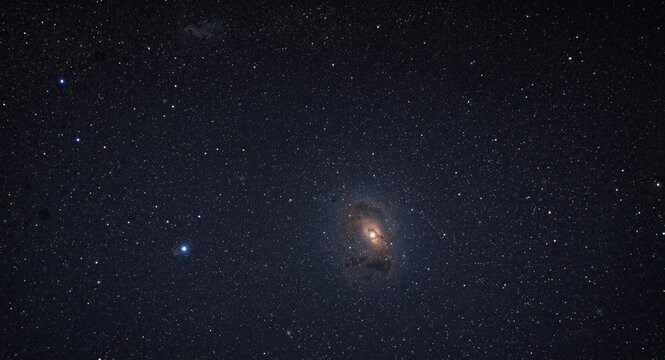 Dazzling cosmic starscape with bright star points and a luminous globular cluster