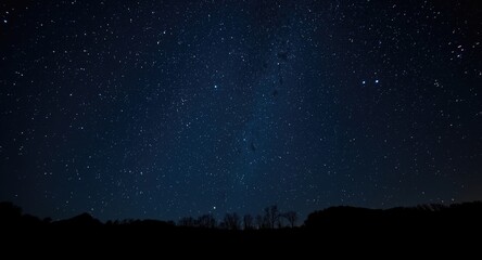 Fototapeta premium Celestial night sky featuring bright stars and dark backdrop