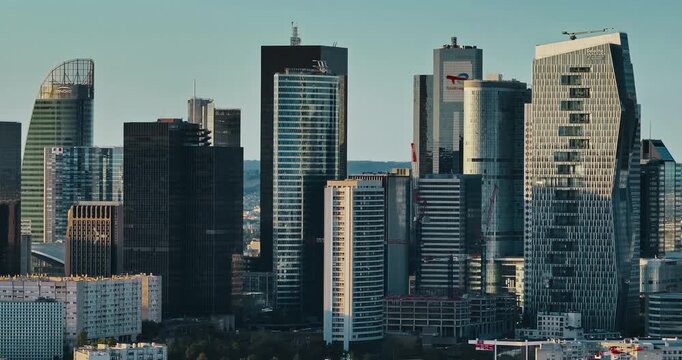 Business district buildings Paris, France. Aerial view of the office windows of a glass skyscrapers. Corporate company head quarter in urban environment. Architectural trends