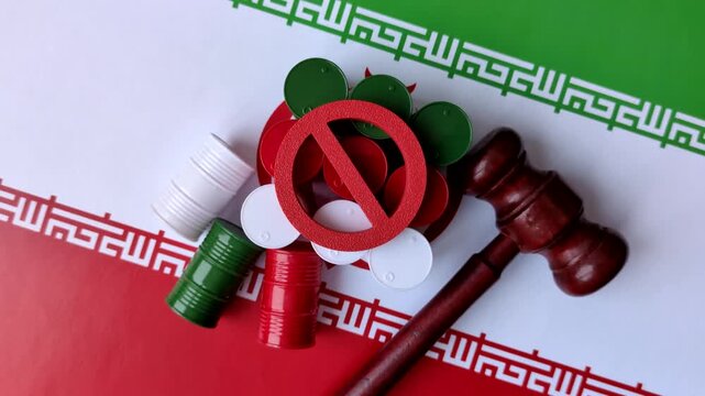Metal barrels of oil, gas, or chemicals bearing the Iranian flag and a ban sign, embargo on Iranian production. Barrels of Iranian oil