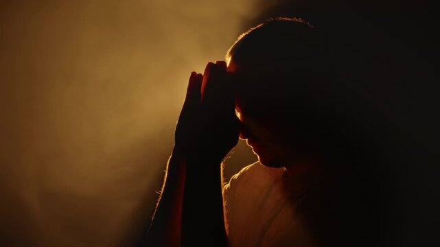 Studio Silhouette of Praying Hands on Third Eye Chakra, Mystery Ritual Light