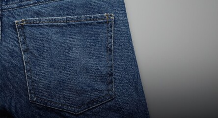 Fototapeta premium Closeup of a denim pocket showing empty space and fabric texture