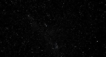 Fototapeta premium Galaxy themed black night texture with sparkling star details