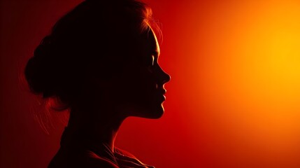 Silhouette of a woman in dramatic red and orange studio lighting, creating a bold and artistic mood.
Concept: Artistic portrait, femininity, emotion, mystery, creative lighting, visual expression.