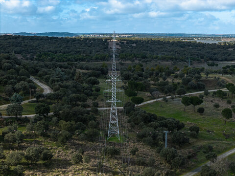 Electricity pylon connecting power lines in Santa Teresa Reservoir, Spain