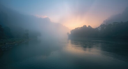 Fototapeta premium Enchanting misty riverscape with dense fog and early light reflections