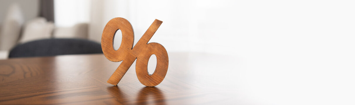 wooden sign of percent