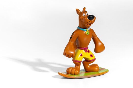 Scooby Doo action figure surfing on a surfboard