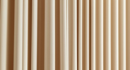 Obraz premium Beige curtain with broad tails arranged in vertical hanging style