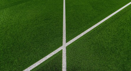 Obraz premium High viewpoint of synthetic grass athletic field with diagonal white line ideal for engaging sports event visuals