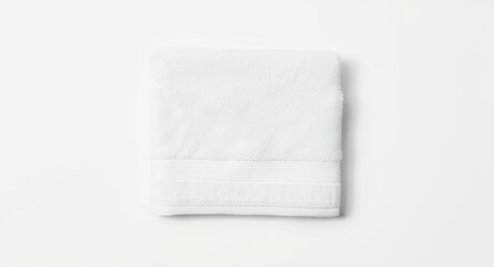 Obraz premium Flat lay top shot of a white towel set on a bright white backdrop perfect for copy space
