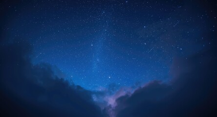 Fototapeta premium Dazzling celestial night sky with an intense blue backdrop filled with shooting stars and gentle clouds
