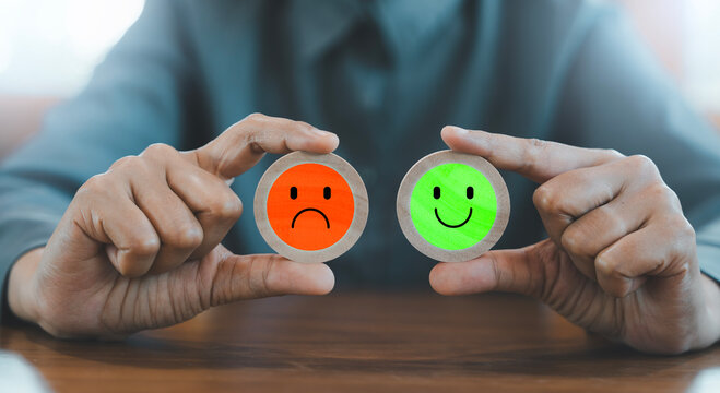 customer satisfaction survey concept, Business person hands holding wooden blocks with green happy smile and red sad frown face icons, Customer service Feedback Review Rating, Compliment Choice