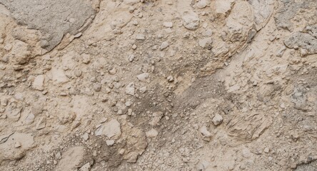Artistic close up of beige rock texture with brushstroke effects resembling soil and natural stone formations