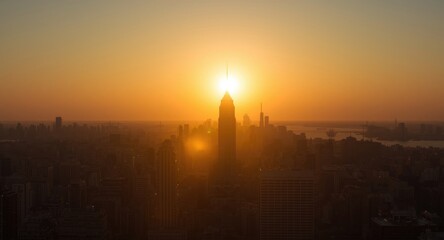 Naklejka premium A radiant dawn sun illuminating tall city structures beautifully