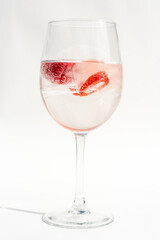 Fruits in a clear glass  on a white background