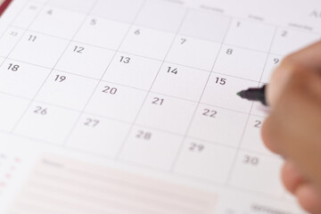 Number 15 focused in the calendar with grey color to point important date for april tax and mid day of the month