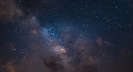 Fototapeta premium Ethereal night sky with sparkling stars and radiant clouds casting light on the galactic canvas