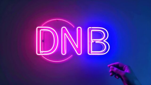 A hand touches a neon sign with the letters "DNB" in pink and blue gradient