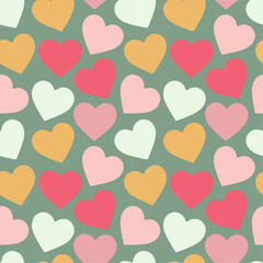 Seamless pattern with colorful hearts on green background. Romantic and playful flat design. For Valentines Day designs, gift wrap, textiles, wallpapers, cards, and stationery. Vector illustration