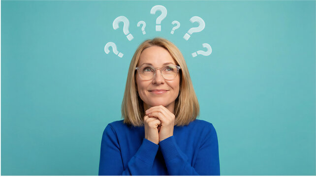 Thoughtful mature woman with question marks above her head.