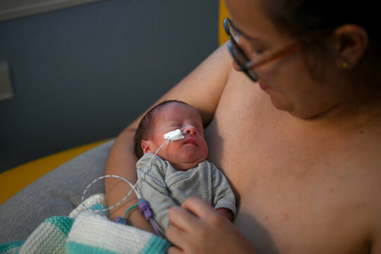 premature baby under observation in a hospital room