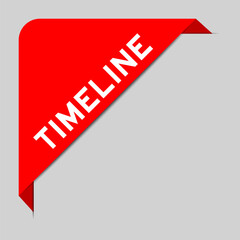 Red color of corner label banner with word timeline on gray background