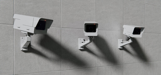 Three security CCTV cameras mounted on wall, security background