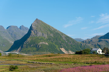 Landscape near Fredvang with the Fredvang Bridges and the distinctive peak of Volandstind. Lofoten in Norway. © Jürgen Wackenhut