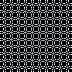 abstract black and white geometric seamless pattern featuring repeating shapes