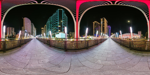 night panorama 360 near skyscraper multistory buildings with illumination of residential quarter complex in full equirectangular seamless spherical projection