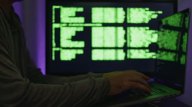 Hacker activity with swift directives, Penetration assessment involving rapid command entries on screen, Cyber intrusion testing conducted in subdued purple setting with intensive keyboard commands