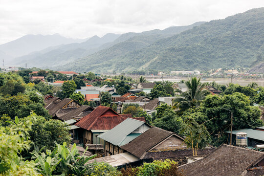 Scenic view of quaint village with lush greenery and mountains in the background. Muong Lay, Thi xa Muong Lay, Dien Bien, Vietnam