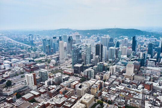 Aerial view of downtown Montreal with skyscrapers and residential buildings on a sunny day. Quebec, Canada
