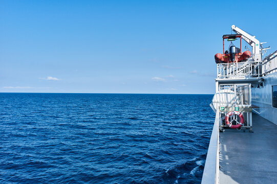 A view from a ship's deck overlooking an endless blue ocean under a clear sky. Lake Huron, Ontario, Canada