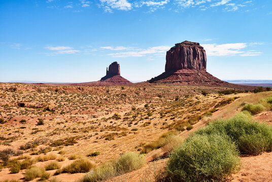 Monument Valley showcases stunning red sandstone formations under a clear azure sky. Monument Valley, Arizona, USA