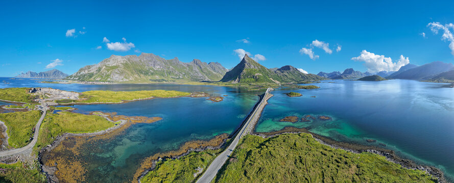 Aerial view near Fredvang with a view of the Fredvang Bridges and the distinctive peak of Volandstind. Lofoten, Norway