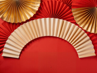 Festive Red and Gold Paper Fan Decoration for Celebrations