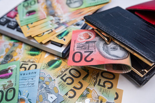 Australian Dollar Banknotes with Calculator and Wallets for Financial Planning and Budgeting Concept