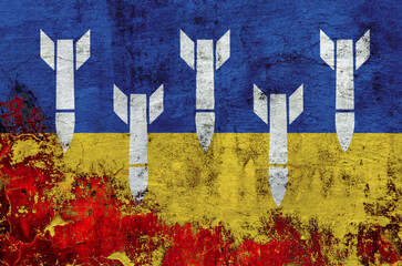 Fototapeta premium military rockets on the background of the national flag of Ukraine on the wall during the war