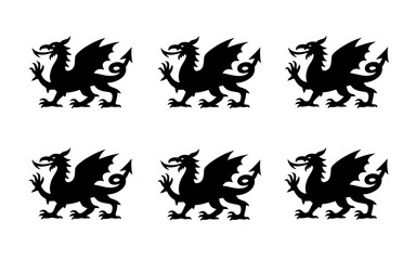 Obraz premium A group of black dragon silhouettes on a white background