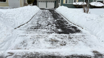 Shoveled Driveway After Snow with Parked Car Visible