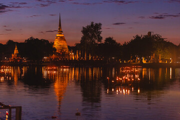 Fototapeta premium Ancient Buddha statue at Sukhothai temple in Thailand, Buddhist stone sculpture symbolizing spirituality, meditation, enlightenment, sacred heritage, peaceful Asian religious landmark