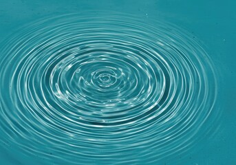 Abstract pattern of concentric ripples on a surface of clear water reflecting bright light and creating dynamic texture background image ,drop ,vibration ,texture