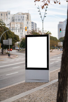 Blank vertical digital screen display mockup in city street, offering advertising space for promotion, marketing, and commercial branding outdoors