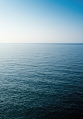 Obraz premium Expansive ocean meeting a vast, clear sky at the distant horizon line, symbolizing unlimited potential and the purity of true liberation ,sea ,journey ,expansive