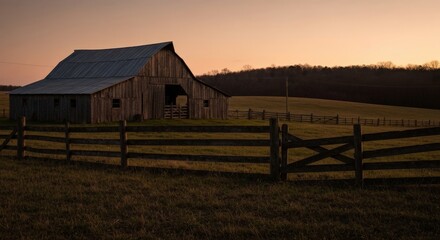Rustic Wooden Barn at Sunset with Fenced Pasture Landscape
