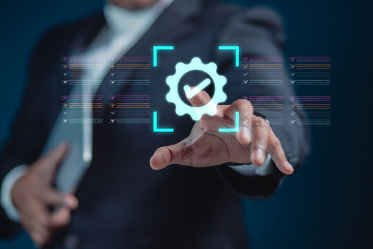 The businessman displays an interface showing digital quality assurance and certification symbols, representing high standards, ISO compliance, and professional business excellence.