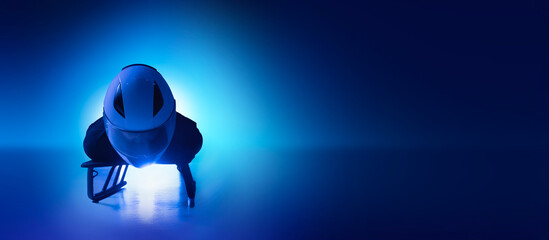 Digital artwork of skeleton athlete in head-first position on blue ice background. Concept of winter sport performance, aerodynamic posture, professional racing, training and competition intensity. © master1305